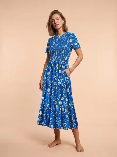 Model wearing a blue floral midi dress — made with Drapify
